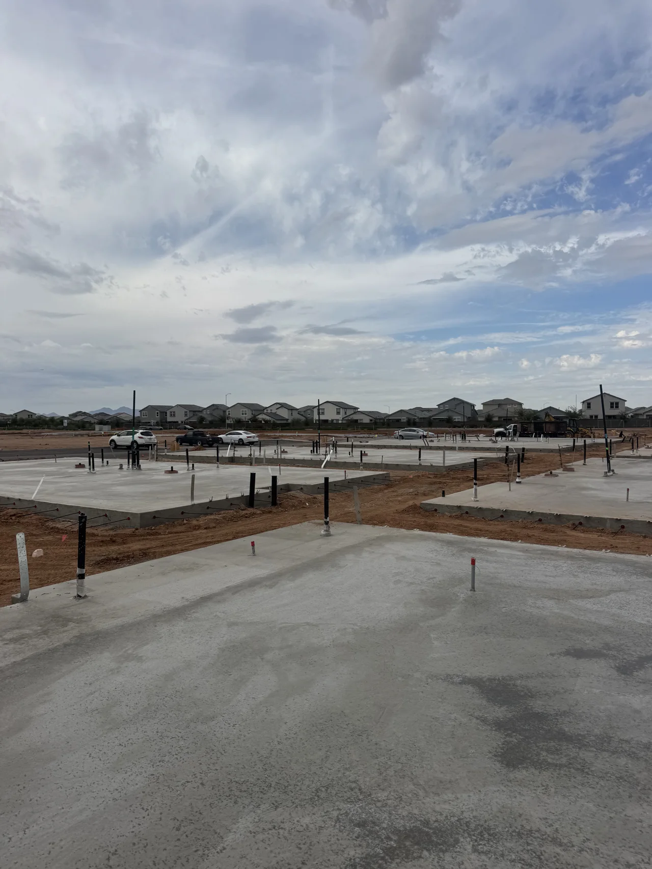Completed concrete slabs with plumbing penetrations at Touchstone at Superstition Vistas